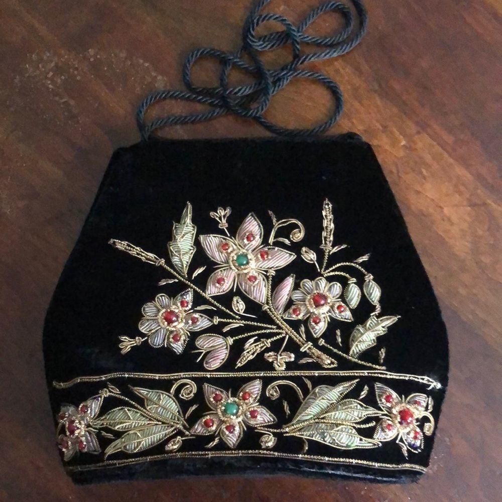Gorgeous gold embroidered evening purse with stones arranged in a floral pattern